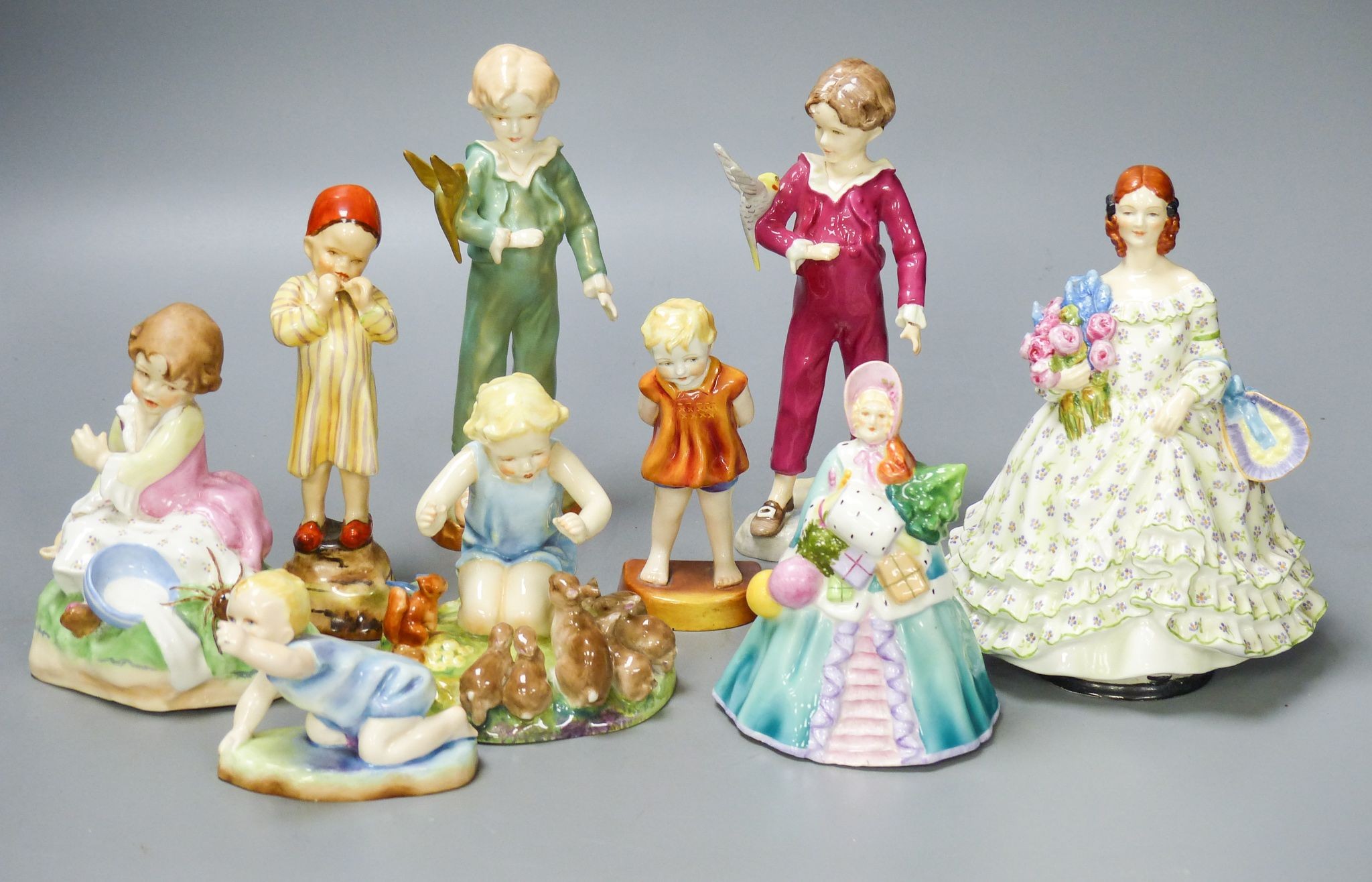 Three Worcester F.G. Doughty figures of children, 4 others and 2 figurines (9)